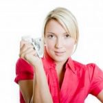 woman-holding-money woman-holding-money