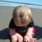 baby on beach sand momspark.net