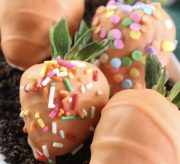 Spring Chocolate-Dipped Carrot Strawberries Recipe - This time of year makes me excited for all things bright and cheery, including the recipes I create. So, today's recipe is just that - springy, fun and DELICIOUS. Spring chocolate-dipped carrot strawberries! A fun recipe to make with the kids and oh-so-yummy for the whole family.