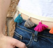 Make a DIY cropped tee that shows as much (or as little) belly as you're comfortable with. Add tassels for a totally on trend look!