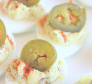 Jalapeño Deviled Eggs Recipe When you think of a potluck dinner, what do you think of? For me, a good potluck HAS to include deviled eggs. It's simply a must-have staple to any family and friend gathering. And while you COULD make deviled eggs the traditional way with mayo, relish, and hard-boiled eggs, why not add a little pizzazz to it? Have your potluck mates raise their eyebrows in approval. Have your potluck mates raise their eyebrows in approval with Jalapeño Deviled Eggs.