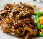 Slow Cooker Asian Honey Garlic Chicken Recipe! Is there anything better than the smell of dinner cooking low and slow in the Crock-pot? I say nope. Like this recipe for Asian Honey Garlic Chicken made in the slow cooker. Chicken breast that is slow cooked in a sweet and tangy sauce and then served over rice or noodles. Perfection!
