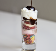 Banana Split Dessert Shots with Fruity Pebbles Recipe - these adorable banana split shots that I created that are small enough to let you indulge your sweet tooth with that perfect Pebbles crunch! These colorful dessert shots are perfect for kid or adult parties and once you try one recipe with Pebbles, you’ll be inspired to try more.
