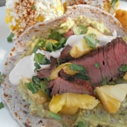 Carne Asada Taco Recipe for Cinco de Mayo! While this Cinco de Mayo recipe may seem long and fussy, it is very simple to put together. To save time you can prepare a few components ahead of time. The combination of spicy peppers, grilled pineapple, and Carne Asada is downright delicious.