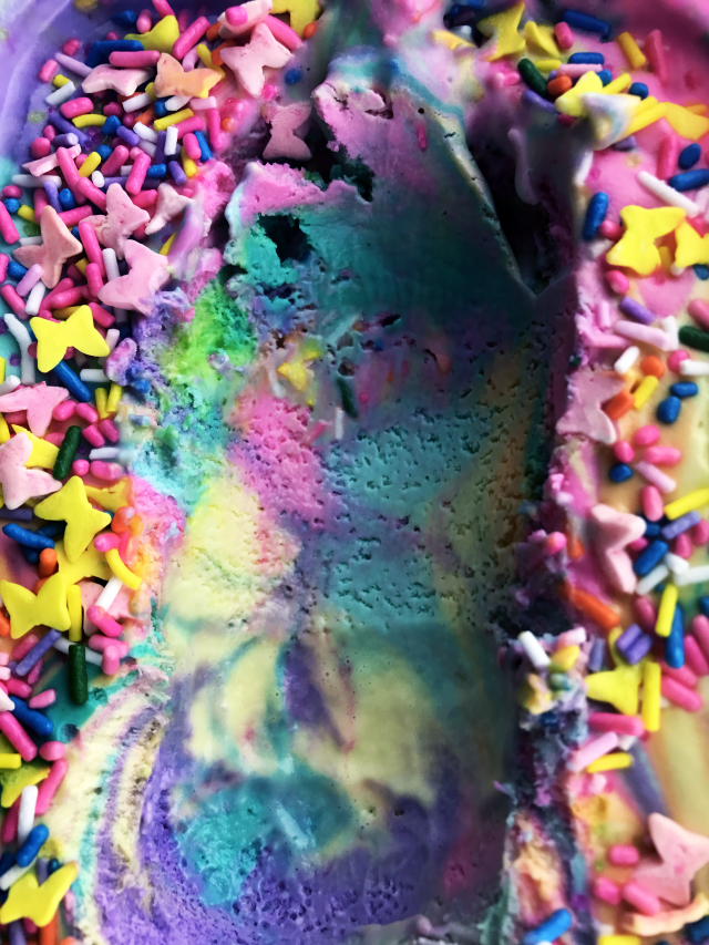 Rainbow Unicorn Ice Cream Recipe - Unicorns may be imaginary magical creatures, but we're still ready to celebrate them. Today's recipe does just that. It's a mixture of bright rainbow ice cream colors covered in sprinkles. This ice cream recipe is perfect for your next fantasy unicorn party celebration. Or just because it's fun and delicious. Either way. No judgment here.