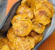 A warm cinnamon brown sugar sweet potato chip recipe that you will have a hard time not gobbling up! Perfect for a snack at home or a party with friends, these sweet potato chips are THE BOMB!