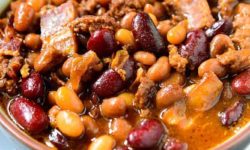 Ground beef, bacon, onions and three varieties of beans, this Crockpot baked beans recipe is the perfect option for a warm, hearty lunch or dinner this fall season.